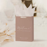Modern Minimalist Dusty Blush Pink Wedding Welcome Medium Gift Bag<br><div class="desc">This minimalist gift bags decorated with romantic and elegant typography. Add elegance - you can change handles to satin ribbon and add guests name tags. To change names, date and welcome text , click «Personalize». To move the text or change the size, font, or color, click «Click to customize further»...</div>