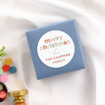 Modern Minimalist Fun & Colorful Merry Christmas Classic Round Sticker<br><div class="desc">Spread holiday cheer with this sticker, featuring “Merry Christmas” in fun bright pastel colors. The word “Love” is written below in handwriting-style script, adding a personal touch, and the family name is displayed at the bottom in bold capital letters for a custom finish. This round sticker is perfect for decorating...</div>