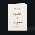 Modern Minimalist Ivory Cream Black Wedding Program<br><div class="desc">Welcome guests to your wedding day with this beautifully designed ivory cream and black folded program that combines simplicity and sophistication. The elegant cover features customizable names and event details in graceful typography, while the inside includes a preformatted template to outline your ceremony and wedding party details. The back is...</div>