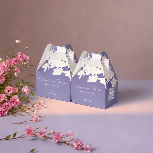 modern minimalist purple flowry favor boxes (Two pastel-colored gift boxes are placed on a smooth surface, accompanied by a decorative)