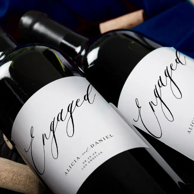 Modern minimalist script engagement party wine label
