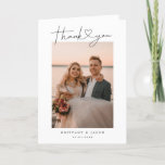Modern Minimalist Script Heart Wedding Photo Thank You Card<br><div class="desc">Elegant and simple wedding thank you folded greeting card featuring a hand lettered typography script text with a heart between the words. This casual script and the white space gives a simple and minimalistic feel. Customize this product by inserting your own vertical wedding photos and editing the message inside the...</div>