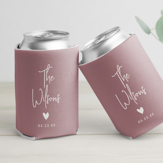 Modern Minimalist Wedding Elegant Last Name Can Cooler (A wedding-themed blush pink can cooler with personalized hand lettered script text and heart design)
