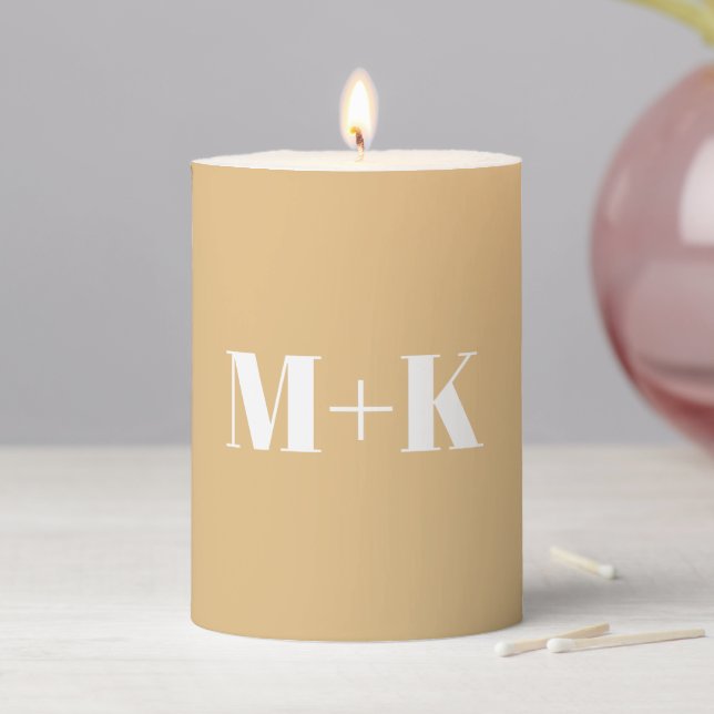 Modern monogram beige tan custom couple's initials pillar candle (In Situ)
