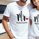 Modern Mr Calligraphy Heart Monogram T-Shirt<br><div class="desc">This handsome "Mr." tee features bold brush calligraphy with a red heart accent and a customizable last name in clean uppercase lettering. The oversized script on white delivers a modern, polished look perfect for honeymoon travel, couples photos, or celebrating newlywed life. Edit the last name to personalize this monogram keepsake....</div>
