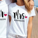Modern Mrs Calligraphy Heart Monogram T-Shirt<br><div class="desc">This beautiful "Mrs." tee features bold brush calligraphy with a sweet red heart accent and a customizable last name in clean uppercase lettering. The oversized script on white creates a modern, romantic look perfect for honeymoon travel, bridal showers, or everyday newlywed style. Edit the last name to personalize this monogram...</div>