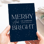 Modern Navy Merry and Bright Non-Photo Holiday Card<br><div class="desc">Modern holiday card featuring "Merry and Bright" displayed in white lettering and navy background with subtle white dots (snow). Personalize the front of the non-photo holiday card with your family name and the year in white lettering. The card reverses to display your personal message in navy lettering or leave it...</div>