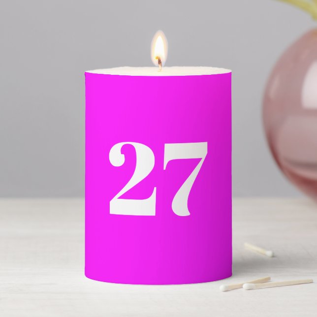 Modern neon magenta custom year number birthday pillar candle (In Situ)