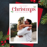 Modern Our First Christmas Newlywed Photo Holiday Card<br><div class="desc">The Modern Our First Christmas Newlywed Photo Holiday Card combines elegant typography with a modern design, beautifully showcasing your favorite photos to celebrate your first Christmas as newlyweds. With festive red accents, this card is the perfect way to share the joy of your newly married life—easily customizable to fit your...</div>