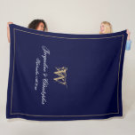 Modern Personalized Newlywed Keepsake Monogram Fleece Blanket<br><div class="desc">Modern Chic Navy Blue Personalized Newlyweds Keepsake Monogram Fleece Blanket. Personalized navy blue and gold monogrammed fleece blanket. Stylish classic script for the initial, the names of the bride and groom, and the wedding date on a simple elegant navy blue background. Perfect wedding gift for newly weds, a cherished reminder...</div>