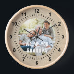 Modern Photo Grandpa Script Heart Clock<br><div class="desc">Modern Photo Grandpa Script Heart Wall Clock features your favorite photo with the text "We (heart) you Grandpa" in a modern white typography overlay. Personalize by editing the text in the text box provided. Designed by ©Evco Studio www.zazzle.com/store/evcostudio</div>