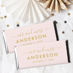 Modern Pink and Gold Mr and Mrs Wedding Hershey Bar Favors<br><div class="desc">A playful yet polished wedding favor wrapper showcasing "Mr and Mrs" in elegant calligraphy script with the couple's surname as the central monogram feature. Soft pink paired with warm gold accents creates a cheerful, feminine aesthetic with a luxe edge. Customize the names and date for a personalized chocolate bar favor...</div>