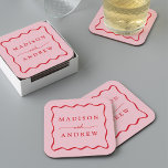 Modern Pink and Red Wavy Frame Wedding Square Paper Coaster<br><div class="desc">Add a stylish touch to your wedding reception, rehearsal dinner, engagement party, or wedding shower with these Modern Pink and Red Wavy Frame paper coasters. The retro wedding coasters display the couple's names in bold red lettering surrounded by a red wavy border contrasting with a pink background. The trendy wedding...</div>