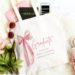 Modern Pink Bow Coquette Graduate Graduation Tote Bag<br><div class="desc">🎀🎓 Modern Pink Bow Coquette Graduate Graduation Tote Bag 🎓🎀 Celebrate your graduation in style and elegance with this Modern Pink Bow Coquette Graduate Graduation Tote Bag! Featuring a delicate pink bow and chic typography, this tote is perfect for carrying your graduation essentials, books, or keepsakes. A coquette-inspired design that...</div>
