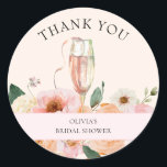 Modern Pink Floral Champagne Bridal Shower Classic Round Sticker<br><div class="desc">This bridal shower thank you favor sticker is perfect for anyone looking to hold a celebratory bridal shower toasting the soon to be bride. The design features a beautiful watercolor flute of pink champagne with bohemian and pretty pink and peachy florals and matching soft blush and creamy background colors. Easily...</div>