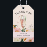 Modern Pink Floral Champagne Bridal Shower Gift Tags<br><div class="desc">This elegant bridal shower gift tag is perfect for anyone looking to raise a toast to the bride to be. The design features bohemian and pretty pink and peachy florals, matching soft blush and creamy background colors with a flute of pink champagne. Easily update the details using the template provided....</div>