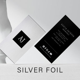 Modern professional monogram black silver foil spot gloss business cards