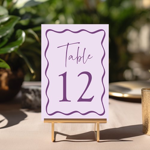 Modern Purple Wavy Frame Wedding Table Number