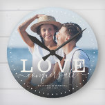 Modern Quote Love Wedding Photo Newlywed Script Round Clock<br><div class="desc">Custom modern chic photo clock with hand-lettered script and modern typography reading:' Love conquers all ' alongside your custom names and wedding date. Personalize with your favorite photo and information. Great gift for newlyweds,  an anniversary or Valentine's Day!</div>