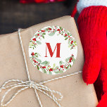 Modern Red Monogram Wreath Berries Christmas Classic Round Sticker<br><div class="desc">The sticker design features a festive holiday wreath surrounding a bold monogram in red. The wreath is decorated with watercolor-style green leaves and vibrant red berries, creating a cheerful and traditional Christmas look. The central monogram can be customized with your initial, adding a personal touch for each recipient. Ideal for...</div>