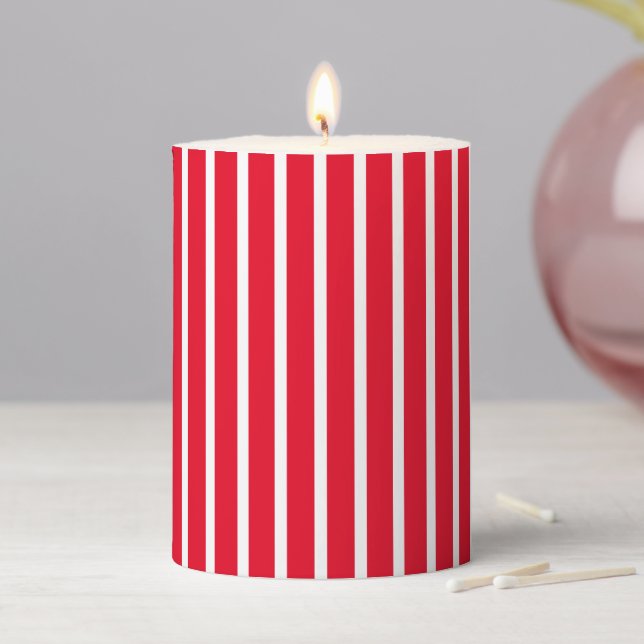Modern red white vertical stripes pattern holiday pillar candle (In Situ)