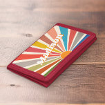 Modern Retro Custom Name Fun Vintage Rainbow Trifold Wallet<br><div class="desc">Introducing the Custom Name wallet with a Modern Retro Fun Vintage Rainbow Sun Burst Illustration. This wallet is a unique and personalized piece that features a vibrant and colorful sunburst design, reminiscent of the retro aesthetic of the 60s and 70s. The groovy rainbow-colored sunburst illustration on this wallet is eye-catching...</div>