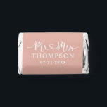 Modern Rose Gold Heart Script Monogram Hershey's Miniatures<br><div class="desc">A glamorous miniature wedding favor featuring "Mr and Mrs" in white decorative heart script calligraphy with the couple's surname displayed as a metallic monogram centerpiece. Warm rose gold tones bring a luxurious, romantic warmth to this elegant design. Personalize the names and wedding date for an elevated reception favor. All text...</div>