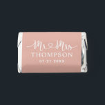 Modern Rose Gold Heart Script Monogram Hershey's Miniatures<br><div class="desc">A glamorous miniature wedding favor featuring "Mr and Mrs" in white decorative heart script calligraphy with the couple's surname displayed as a metallic monogram centerpiece. Warm rose gold tones bring a luxurious, romantic warmth to this elegant design. Personalize the names and wedding date for an elevated reception favor. All text...</div>