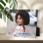Modern Rose Gold Script Graduate Photo Graduation Plaque<br><div class="desc">Stylish and elegant graduation plaque sign with easel features a senior photo with "graduate" faux rose gold foil script overlay. Personalize the modern custom text with your grad's name,  school,  and class year. Makes a beautiful keepsake to display in your home!</div>