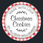 Modern Rustic Homemade Christmas Cookies Red Check Classic Round Sticker<br><div class="desc">Rustic, modern and simple homemade baked goods apple pie sticker with the text made with love, Christmas cookies and your name in elegant handwritten script calligraphy and typography on a red check pattern background with a stylish touch of foliage. Simply add your name and the product name to the label....</div>