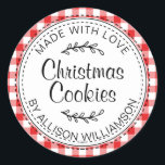 Modern Rustic Homemade Christmas Cookies Red Check Classic Round Sticker<br><div class="desc">Rustic, modern and simple homemade baked goods apple pie sticker with the text made with love, Christmas cookies and your name in elegant handwritten script calligraphy and typography on a red check pattern background with a stylish touch of foliage. Simply add your name and the product name to the label....</div>
