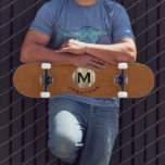 Modern Sable Leather Gold Monogram Skateboard<br><div class="desc">A modern monogram design with classic block typography initial on a trendy metallic brushed gold emblem with your name below on a sable brown distressed leather look background.</div>