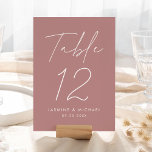 Modern Script Dusty Rose Wedding Table Number Card<br><div class="desc">Simple, modern wedding table number cards featuring "Table" displayed in a handwritten white script with a dusty rose background (or a color of your choosing). To order the dusty rose wedding table cards: add your name, wedding date, and table number. Each number needs to be added to your cart individually....</div>