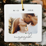 Modern Script Elegant Engagement Photo Keepsake Ceramic Ornament<br><div class="desc">This modern script ENGAGED Photo ornament features two of your engagement photos (on the front and back) as well as your monograms and the date of your celebration. This stylish keepsake will remind you of the day you said YES for decades to come.</div>