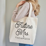 Modern Script Future Mrs Tote Bag Gift for Her<br><div class="desc">Celebrate the bride-to-be in style with this personalized “Future Mrs” tote bag, featuring elegant modern script typography and a clean, timeless design. Customize it with a name or future last name to create a meaningful keepsake she’ll love using long after the wedding celebrations end. Perfect as a bachelorette party gift,...</div>