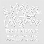 Modern Script Merry Christmas Return Address Embosser<br><div class="desc">Stylish Merry Christmas personalized holiday return address embosser features script writing and accents of branches with holly leaves and berries. Personalize the modern text with your family's last name and home address.</div>