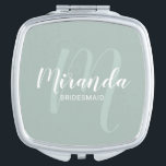 Modern Script Personalized Bridesmaid Compact Mirror<br><div class="desc">Add a personal touch to your wedding with personalized bridesmaid gift. This design features personalized bridesmaid's name in white modern script font style and monogram in sage green modern script font style as background with title and wedding date in white modern sans serif font style on sage green background. Also...</div>