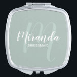 Modern Script Personalized Bridesmaid Compact Mirror<br><div class="desc">Add a personal touch to your wedding with personalized bridesmaid gift. This design features personalized bridesmaid's name in white modern script font style and monogram in sage green modern script font style as background with title and wedding date in white modern sans serif font style on sage green background. Also...</div>
