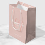 Modern Script Personalized Bridesmaids Medium Gift Bag<br><div class="desc">Personalized Bridesmaids Gift Bag featuring personalized bridesmaid's name in white modern script font style and monogram in blush pink modern script font style as background with title and wedding date in white modern sans serif font style on blush pink background. Also perfect for maid of honor, flower girl, mother of...</div>