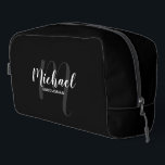 Modern Script Personalized Groomsman Monogram Name Dopp Kit<br><div class="desc">Add a personal touch to your wedding with personalized groomsman gift. This design features personalized groomsman's name in white modern script font style and monogram in light grey modern script font style as background with title in white modern sans serif font style on black background. Also perfect for maid of...</div>