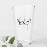Modern Script Personalized Groomsmen Glass<br><div class="desc">Add a personal touch to your wedding with personalized groomsmen glass. This glass features personalized groomsmen's name in grey modern script font style and monogram in light grey modern script font style as background with title in grey modern sans serif font style. Also perfect for best man, father of the...</div>