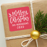 Modern Script Red Merry Christmas Custom Square Sticker<br><div class="desc">Stylish Merry Christmas holiday favor sticker features white script writing and accents of branches with holly leaves and berries. Personalize with custom name / family and year text. The crimson red background color can be modified.</div>