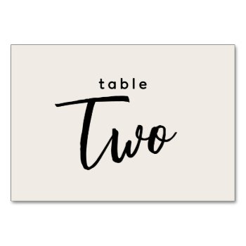 Modern Script Table 2 Two Off-white Wedding Table Number by GraphicBrat at Zazzle
