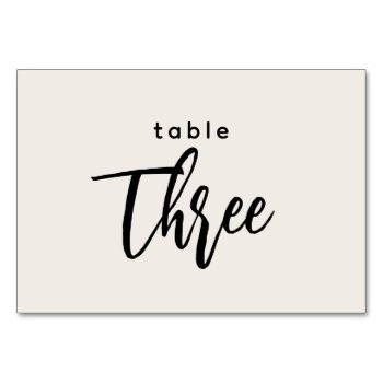 Modern Script Table 3 Three Off-white Wedding Table Number by GraphicBrat at Zazzle