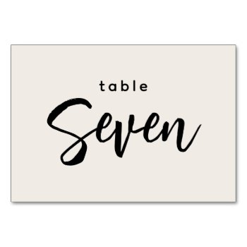 Modern Script Table 7 Seven Off-white Wedding Table Number by GraphicBrat at Zazzle