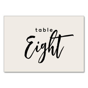 Modern Script Table 8 Eight Off-white Wedding Table Number by GraphicBrat at Zazzle
