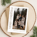 Modern Script Vertical Two Photo Family Christmas Holiday Card<br><div class="desc">Celebrate the festive season with a touch of elegance using this modern two-photo family holiday card. Featuring a minimalist design and a stylish vertical script, this card offers a timeless boho rustic aesthetic. Perfect for displaying cherished family moments, its chic, contemporary look combines modern simplicity with a touch of vintage...</div>