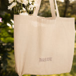 Modern Simple Pink Bride Typography Engagement Embroidered Tote Bag<br><div class="desc">This tote bag features a sleek and modern design with pink typography that adds a stylish flair. The embroidered details give it a high-quality finish, making it an elegant choice for any occasion. Whether you're celebrating your engagement or enjoying your honeymoon, this bag will make you feel like the center...</div>