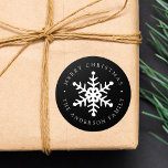 Modern Snowflake Black Holiday Sticker<br><div class="desc">Add a personalized touch to your holiday gifts and envelopes with these elegant snowflake stickers. The custom holiday stickers feature a white hand-drawn snowflake in the middle with your custom greeting and family name in white lettering on a black background. The modern holiday stickers are perfect to add to use...</div>