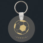 Modern Soccer in Black and Gold Personalized Keychain<br><div class="desc">The soccer player or soccer fan in your life will love these personalized keychains featuring a gold soccer ball. Perfect as a party favor. Coordinates with Parcel Studio's Soccer Star collection. Background color and text is customizable. *Note: The gold in this product is simulated. No actual gold will be used...</div>